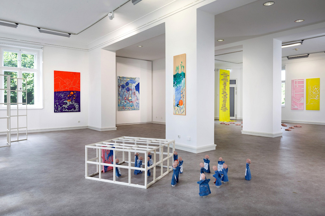 Camille Tsvetoukhine: House of Illusions, 2025, window frame, marionettes made of burnt red sandstone and denim, 80 × 80 × 37 cm, exhibition view 2025, Kebbel Villa, Schwandorf (Photo: Clemens Mayer)